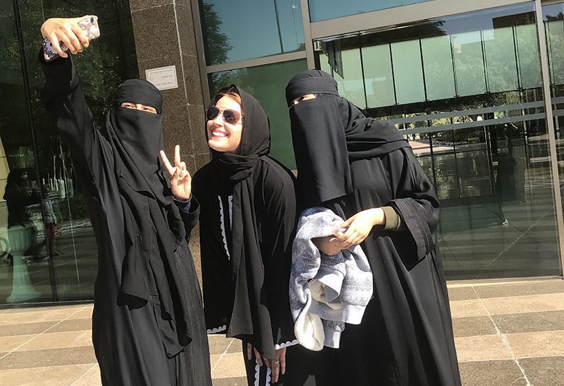 TEI’s Jennifer Wesselhoff (center) poses in Alu Ula with two Saudi Arabian friends.